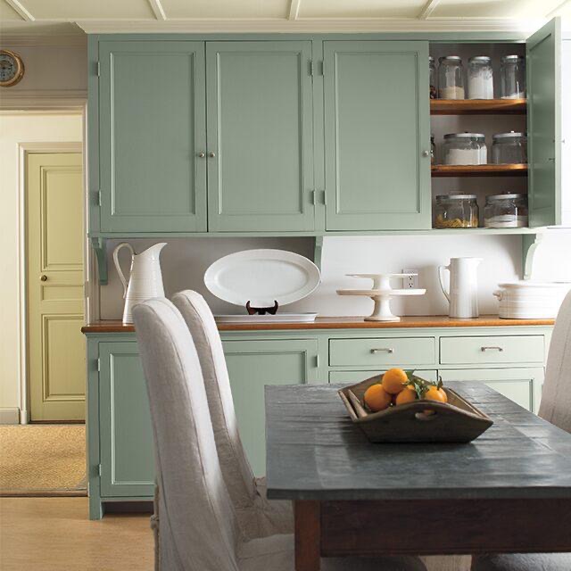 Kitchen With Hand Painted Cabinets In Light Green.